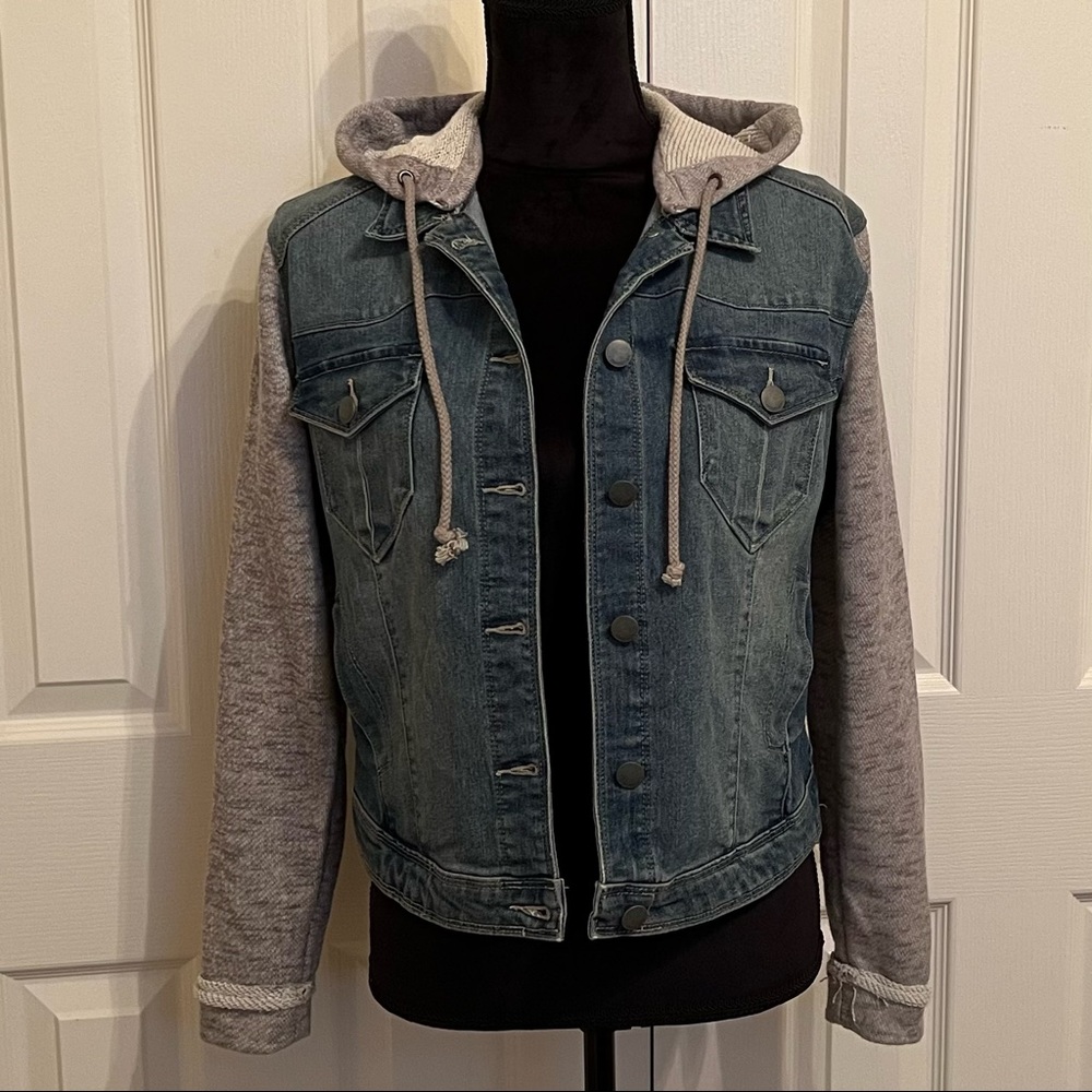 Tinseltown denim jacket with grey sweatshirt sleeves and removable hood.